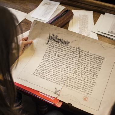 Student studying a facsimile in paleography class